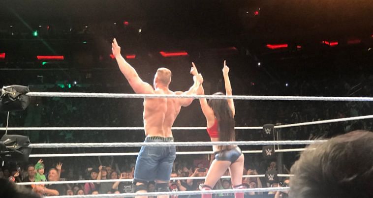 Cena and Nikki celebrate their win (Courtesy: @CavemanRobles)
