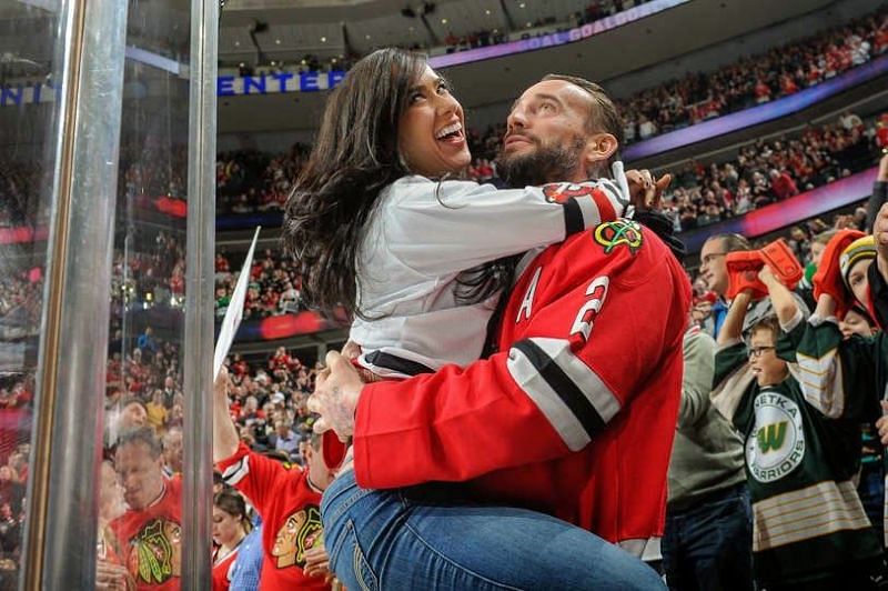 The First Couple of Chicago wrestling take in a Blackhawks game together.