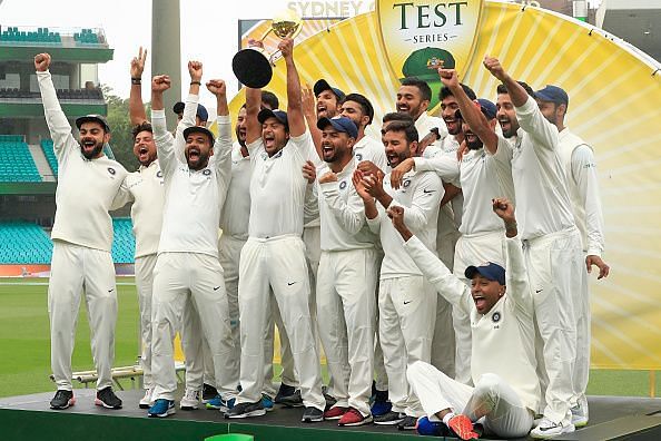 The Indian team lifting the Border-Gavaskar Trophy