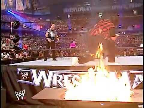 Edge spears Foley on fire