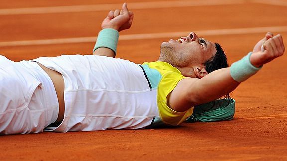 Rafael Nadal celebrating in his own trademark style after his victory against Novak Djokovic in the semi-finals of Madrid Open 2009.