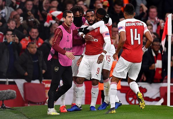 Lacazette wheels away to celebrate one of his two goals - though he should have had more