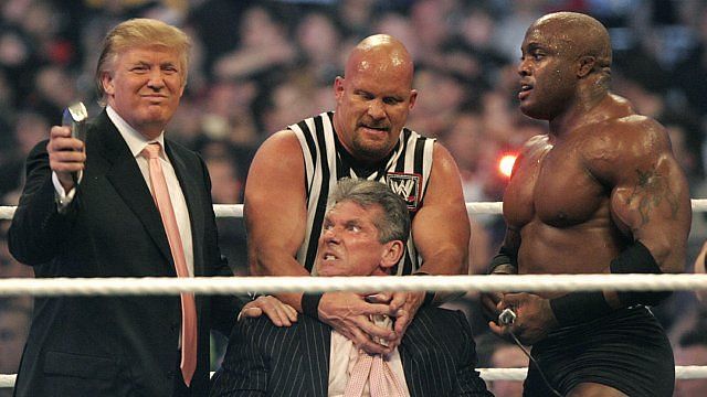 Donald Trump prepares to shave Vince McMahon&#039;s head, egged on by Stone Cold Steve Austin and Trump&#039;s &#039;champion&#039; Lashley.