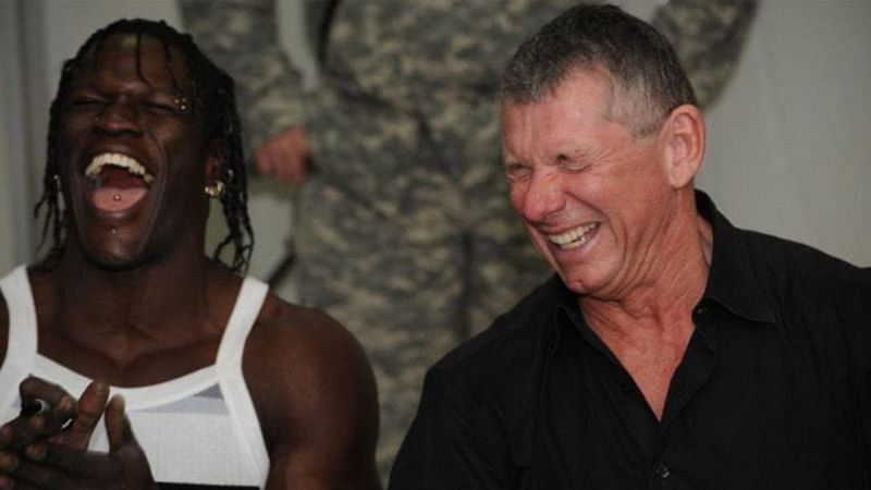 Vince McMahon and R-Truth laughing at a Baron Corbin promo, probably