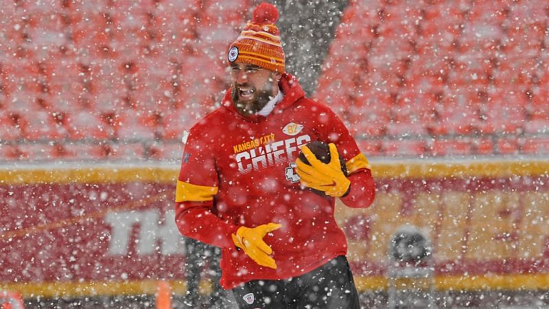 Kansas City Chiefs tight end Travis Kelce warms up in the snow at Arrowhead Stadium.