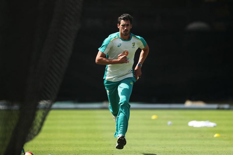 Mitchell Starc runs in to bowl during training.
