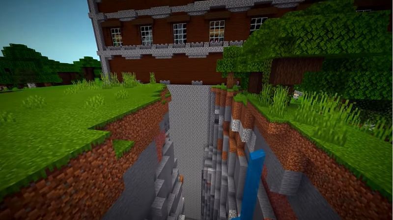 Mansion that brokenly spawned right over a ravine. (Image via Minecraft &amp; Chill/YouTube)