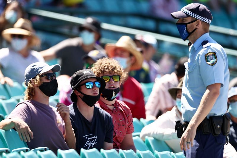 Police speaks to spectators at the SCG following a complaint from Mohammed Siraj