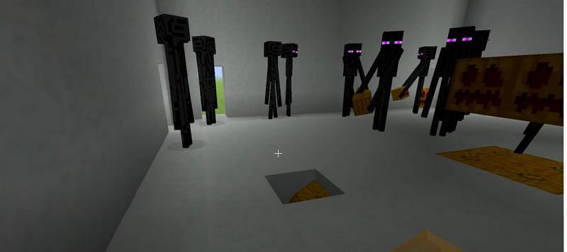 Endermen mobs creating a Snow Golem in Minecraft (Image via ibxtoycat/YouTube)