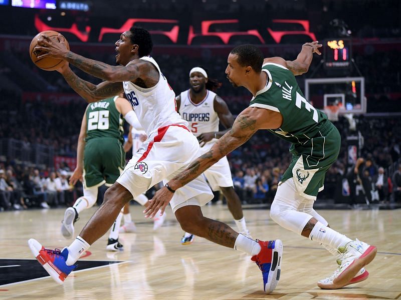George Hill (R) in action against the LA Clippers during the 2019-20 campaign