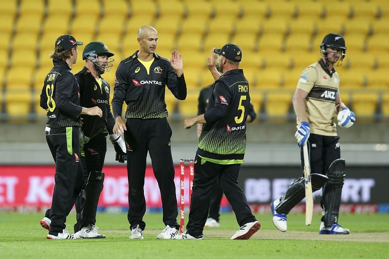 Ashton Agar celebrates a wicket with teammates.