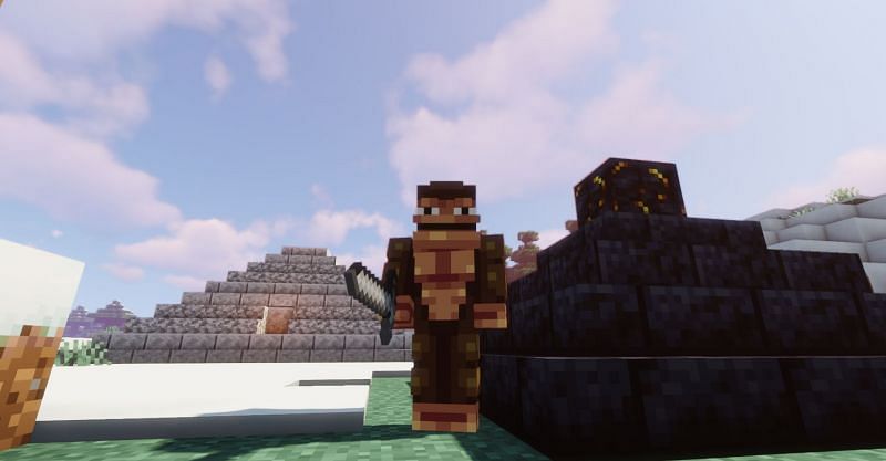 Shown: A Monke standing next to his monolithic creations (Image via Minecraft)