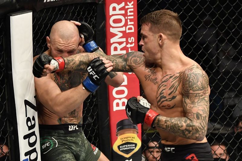 Dustin Poirier works Conor McGregor against the cage