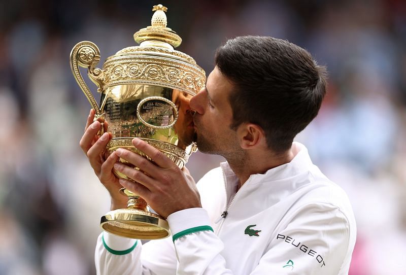 Novak Djokovic poses with his Wimbledon 2021 title.