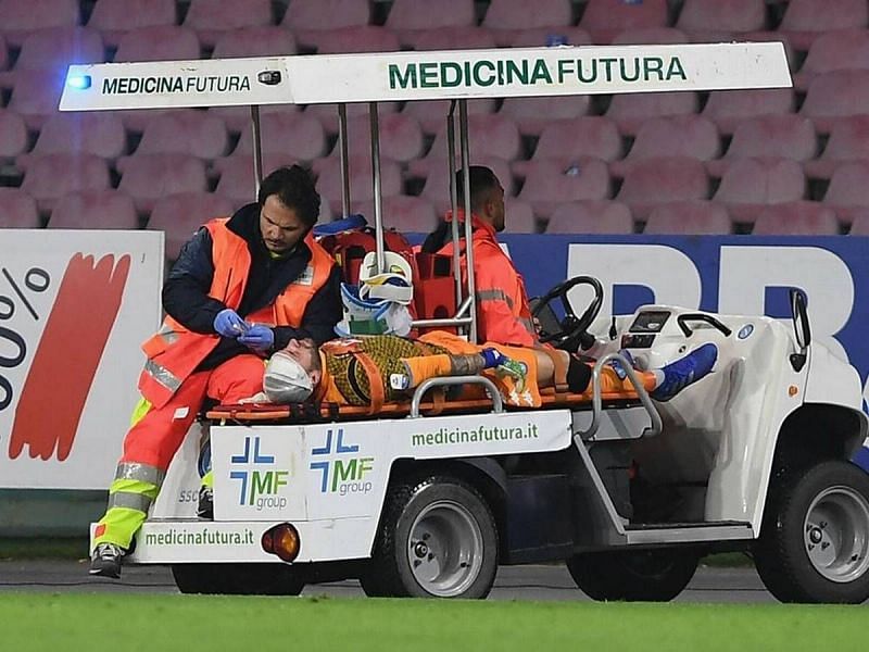 David Ospina taken off on a stretcher after collapsing on the pitch.
