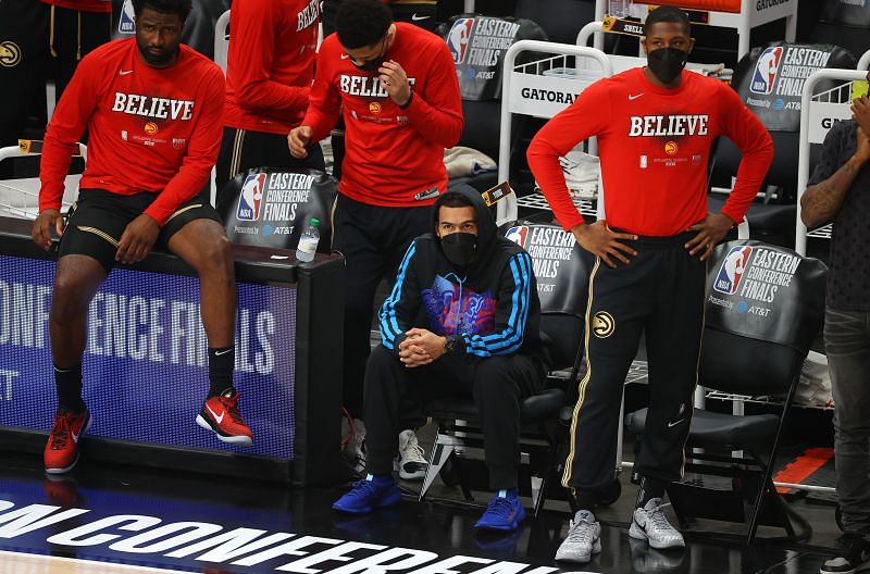 Trae Young #11 sits on the bench in Game 4
