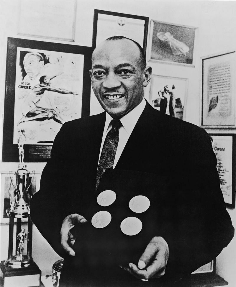 Jesse Owens Poses With Gold Medals