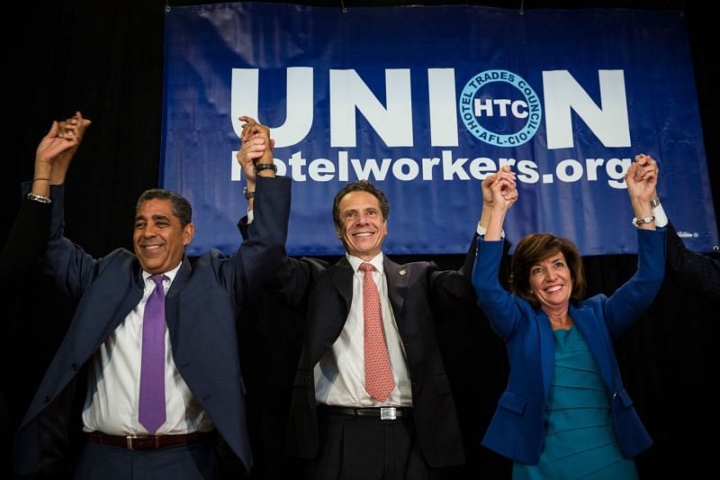 Kathy Hochul with Andrew Cuomo and Adriano Espaillat. (Image via Getty Images)