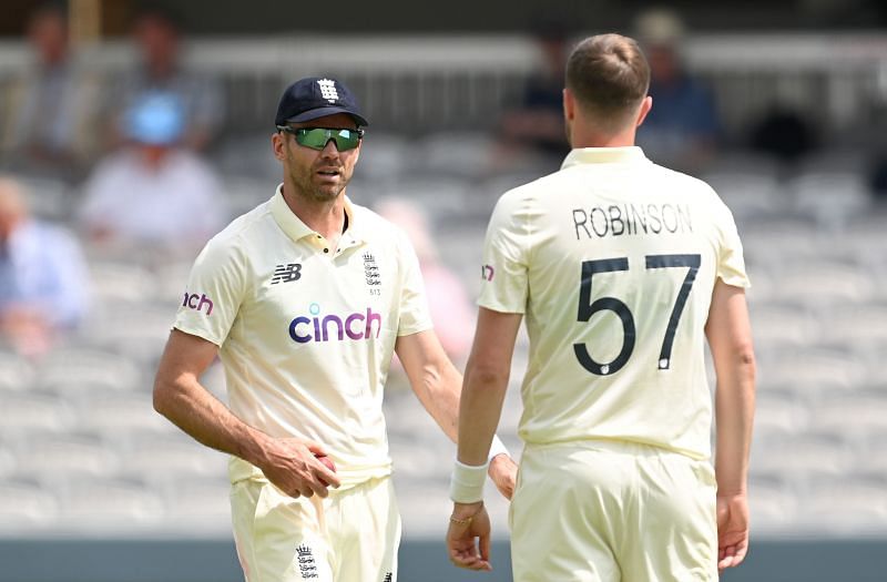 James Anderson speaks to Ollie Robinson during a Test match.