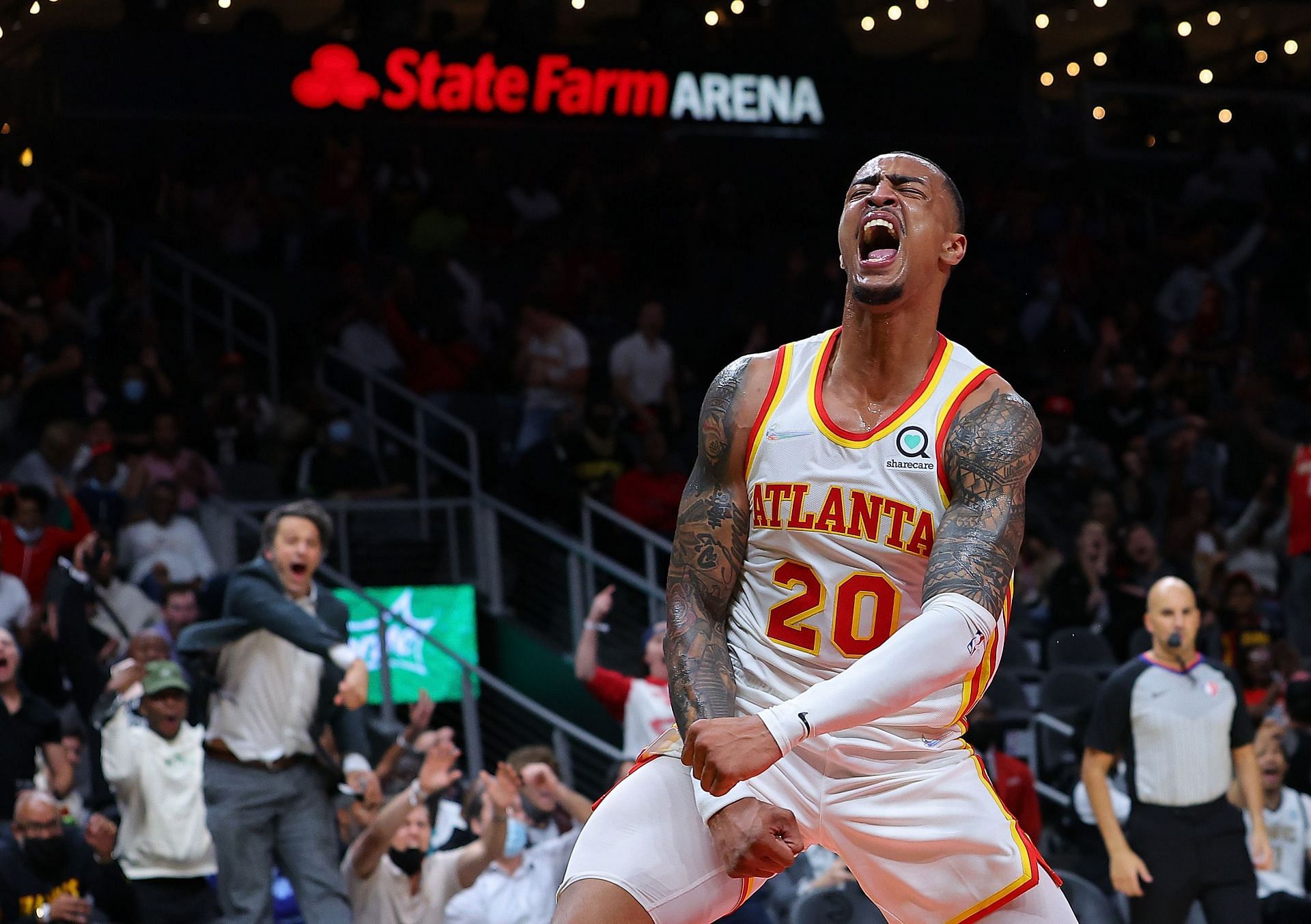 John Collins of the Atlanta Hawks reacts during a game.