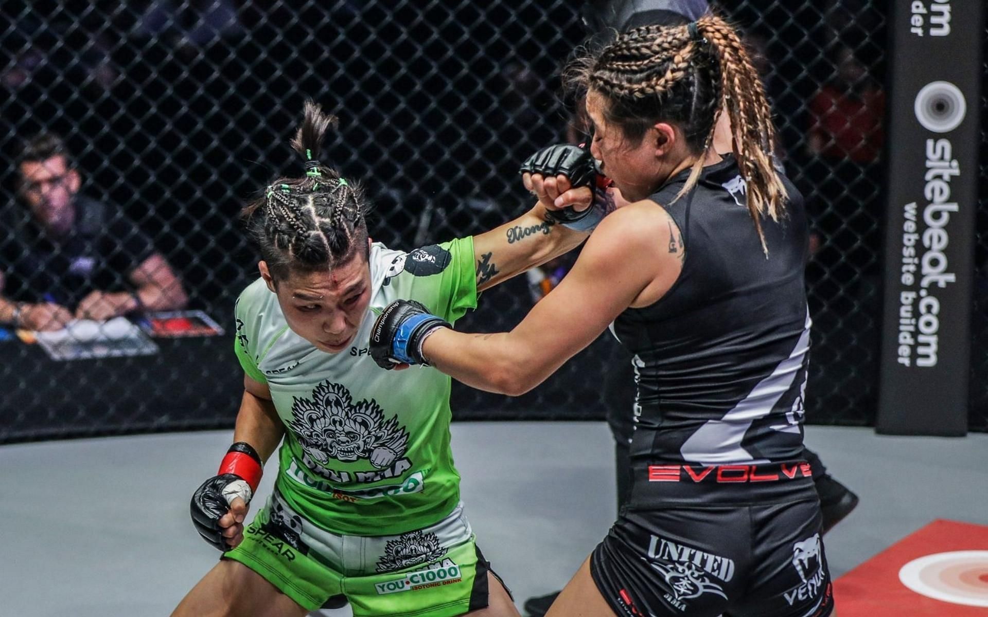 ONE Championship strawweight world champion Xiong Jing Nan (left) and ONE atomweight champion Angela Lee (right) have had one of the most epic rivalries in MMA history. (Image courtesy of ONE Championship)