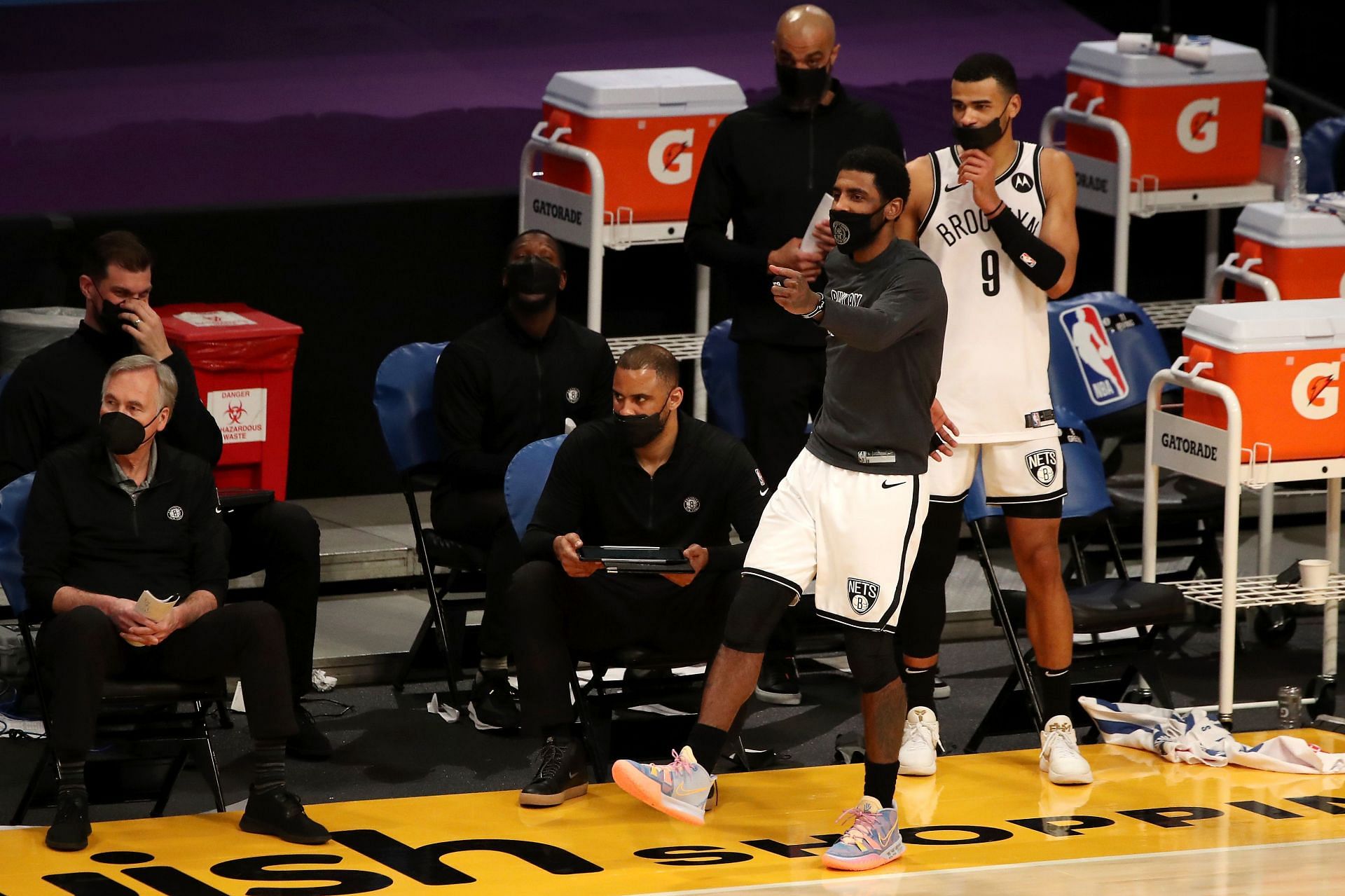Brooklyn Nets guard Kyrie dances on the sideline during a February 2021 game against the LA Lakers