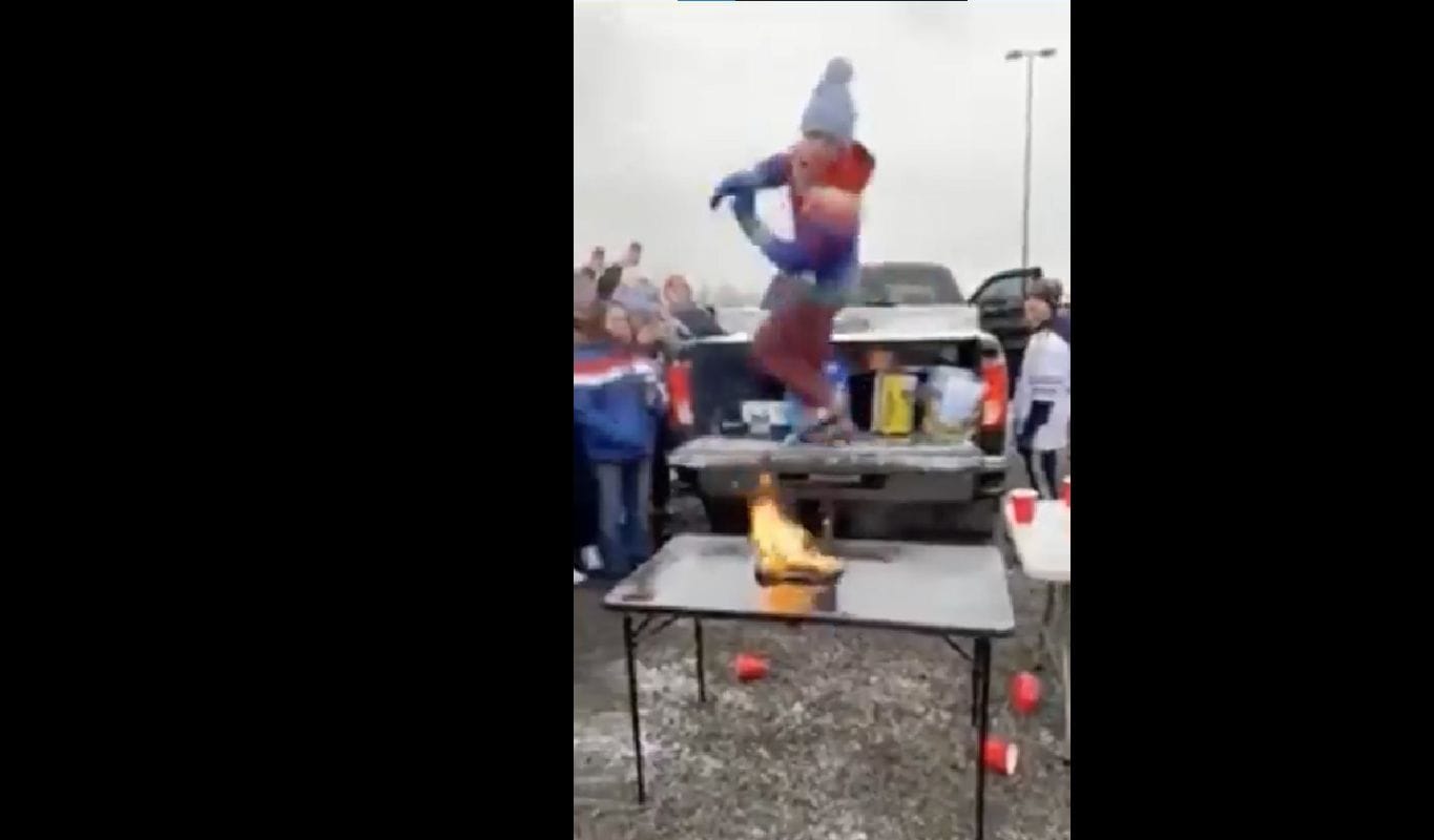 Watch Bills fan takes pregame ritual to next level by jumping on to