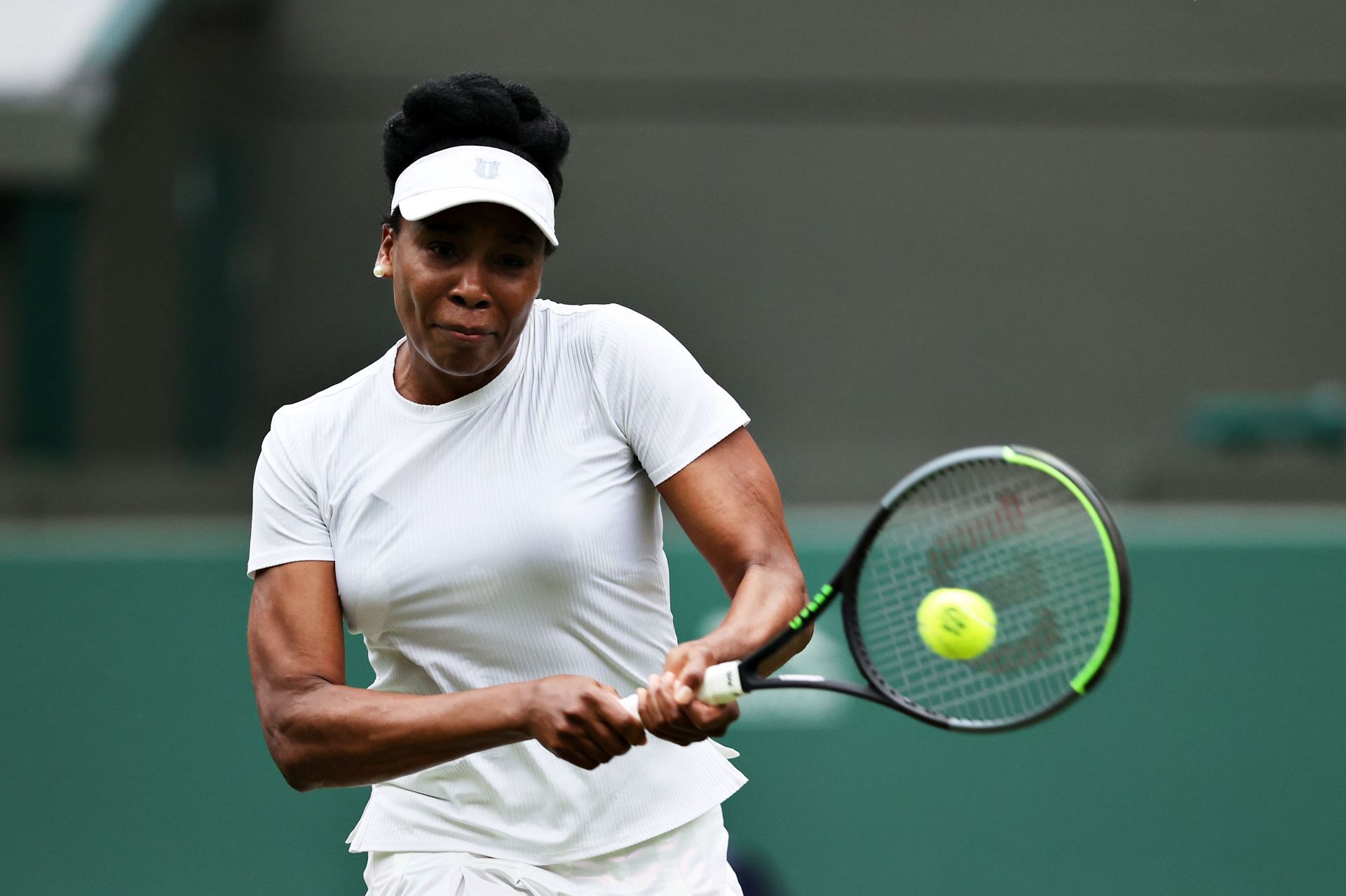 Venus Williams hits a backhand at the 2021 Wimbledon Championships