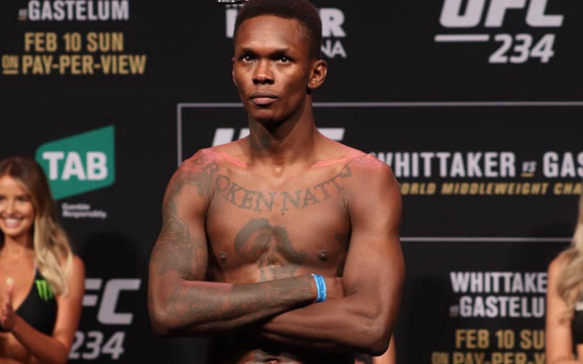 Israel Adesanya shows off a mounted guillotine at City Kickboxing