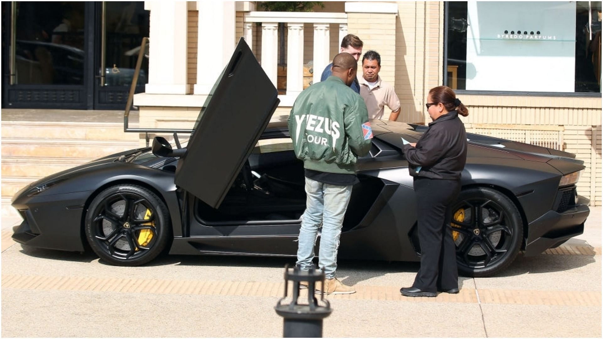 Kanye West with his Lamborghini Aventador (Image via Bauer-Griffin/Getty Images)