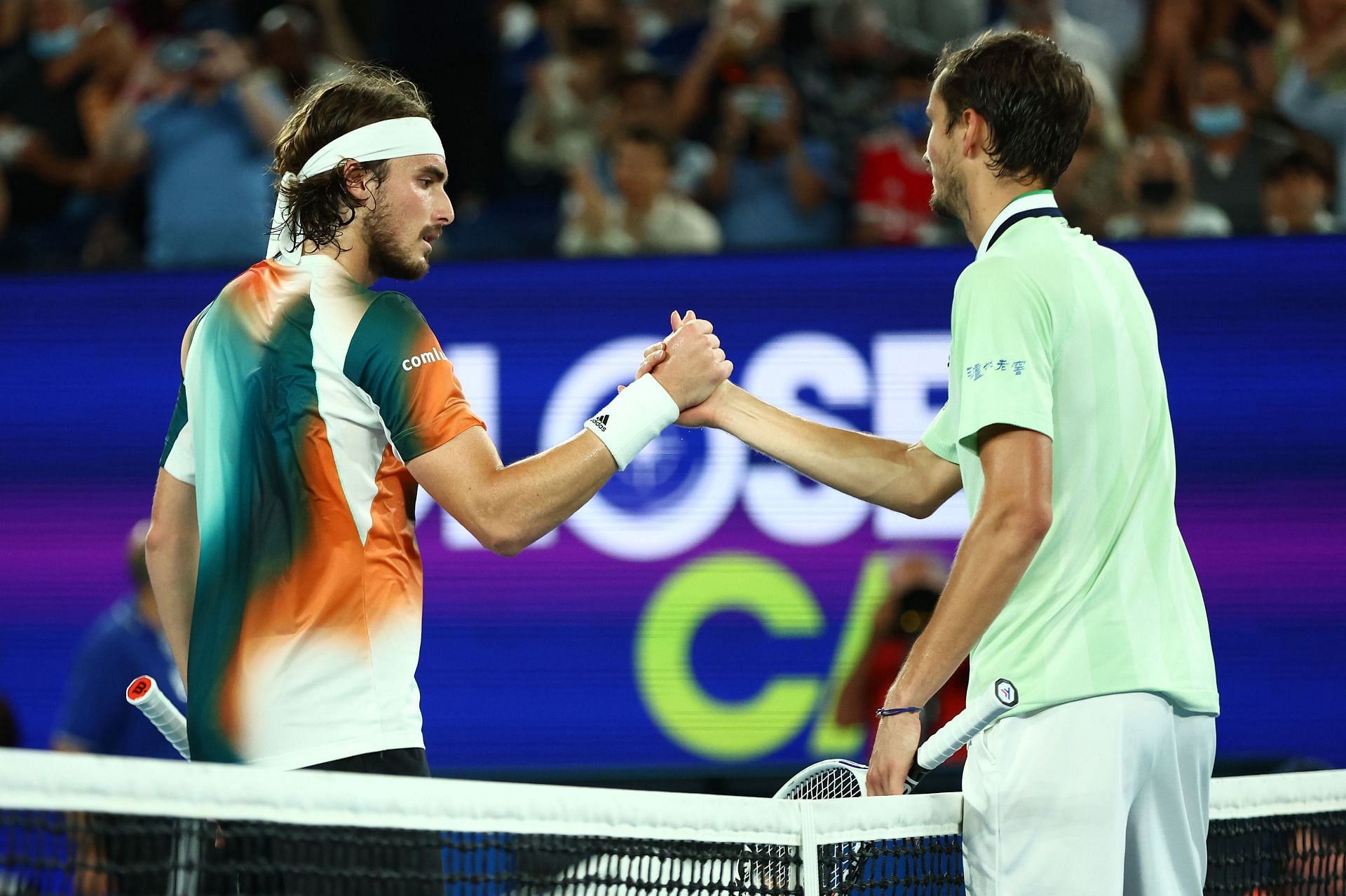 Stefanos Tsitsipas (L) &amp; Daniil Medvedev shake hands after their semifinal at 2022 Australian Open.
