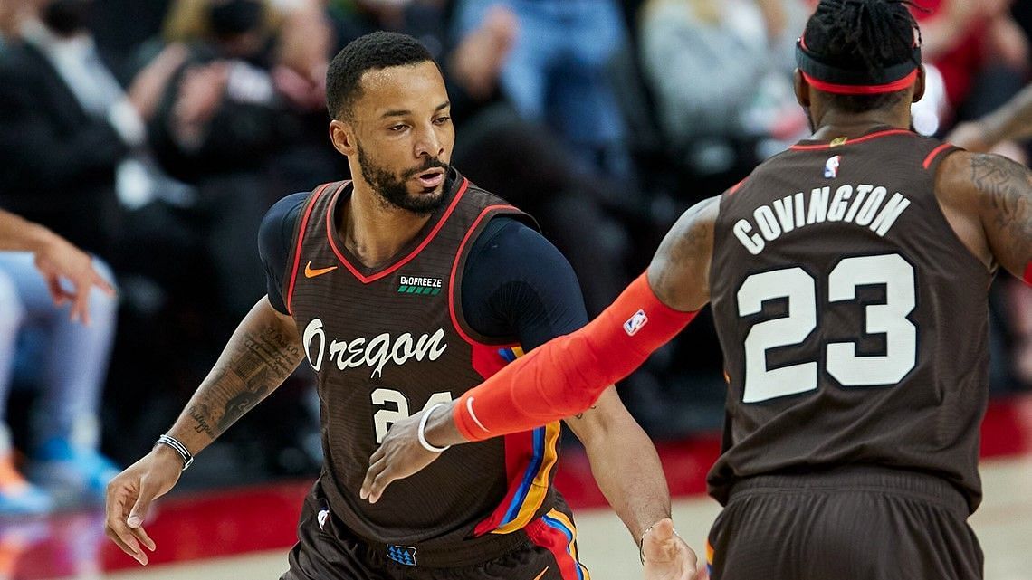 Norman Powell and Robert Covington of the Portland Trail Blazers [Source: AP]