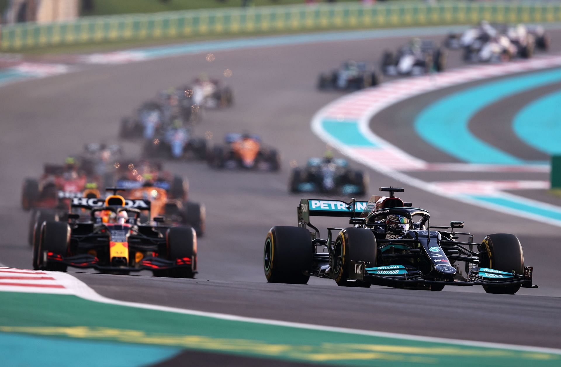 Lewis Hamilton leads Max Verstappen at the start of the F1 Grand Prix of Abu Dhabi (Photo by Lars Baron/Getty Images)
