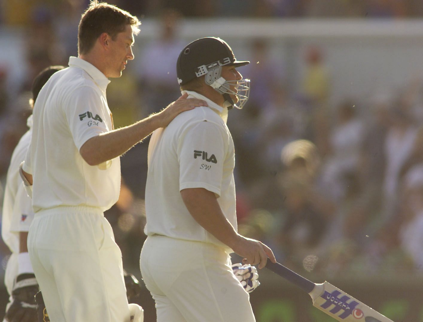 A dejected Shane Warne of Australia is consoled by teammate Glenn McGrath after being dismissed for 99 (his highest Test score) against New Zealand in Perth in 2001. Pic: Getty Images
