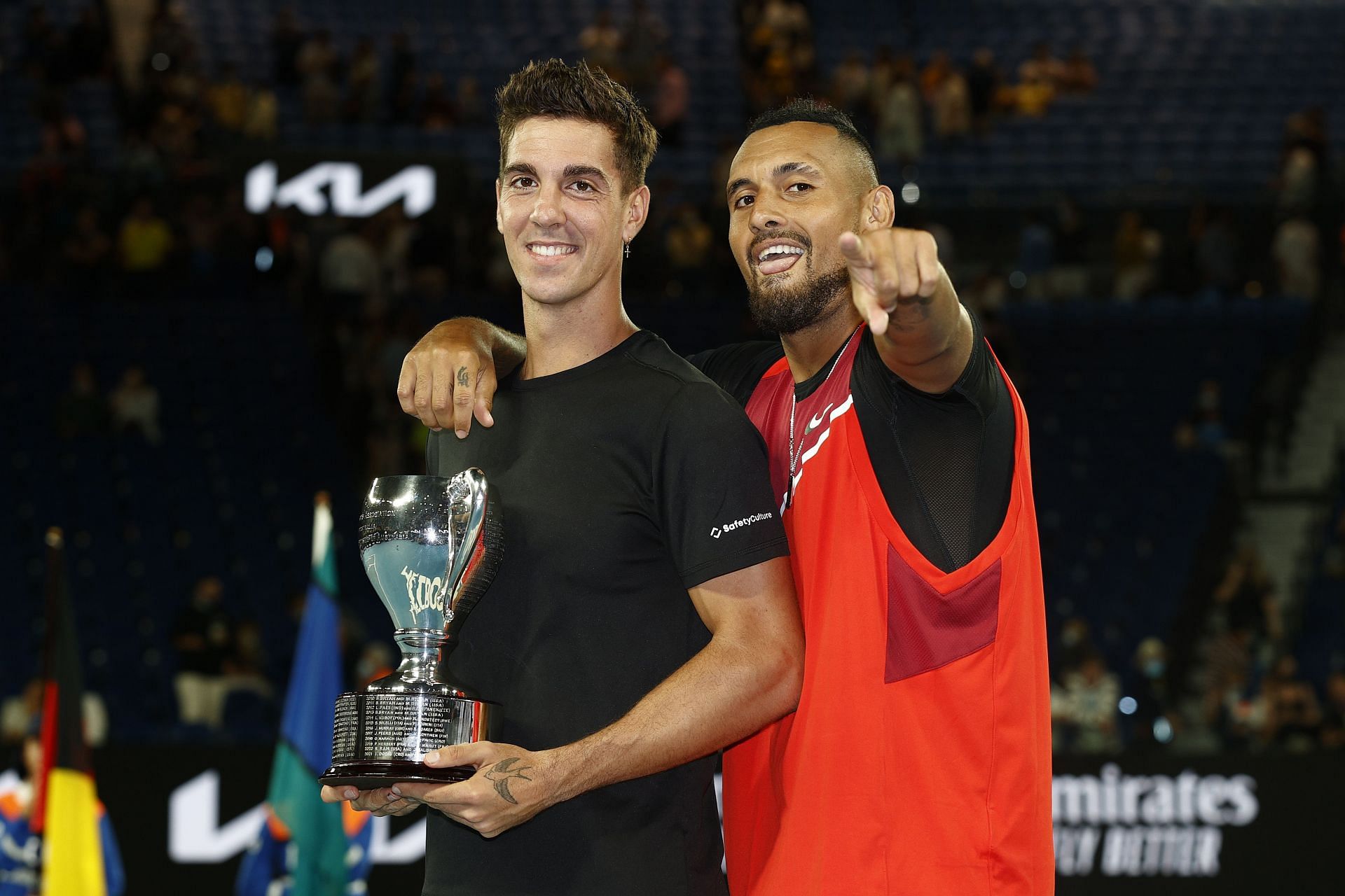 Thanasi Kokkinakis (L) won the doubles title at the 2022 Australian Open with Nick Kyrgios.