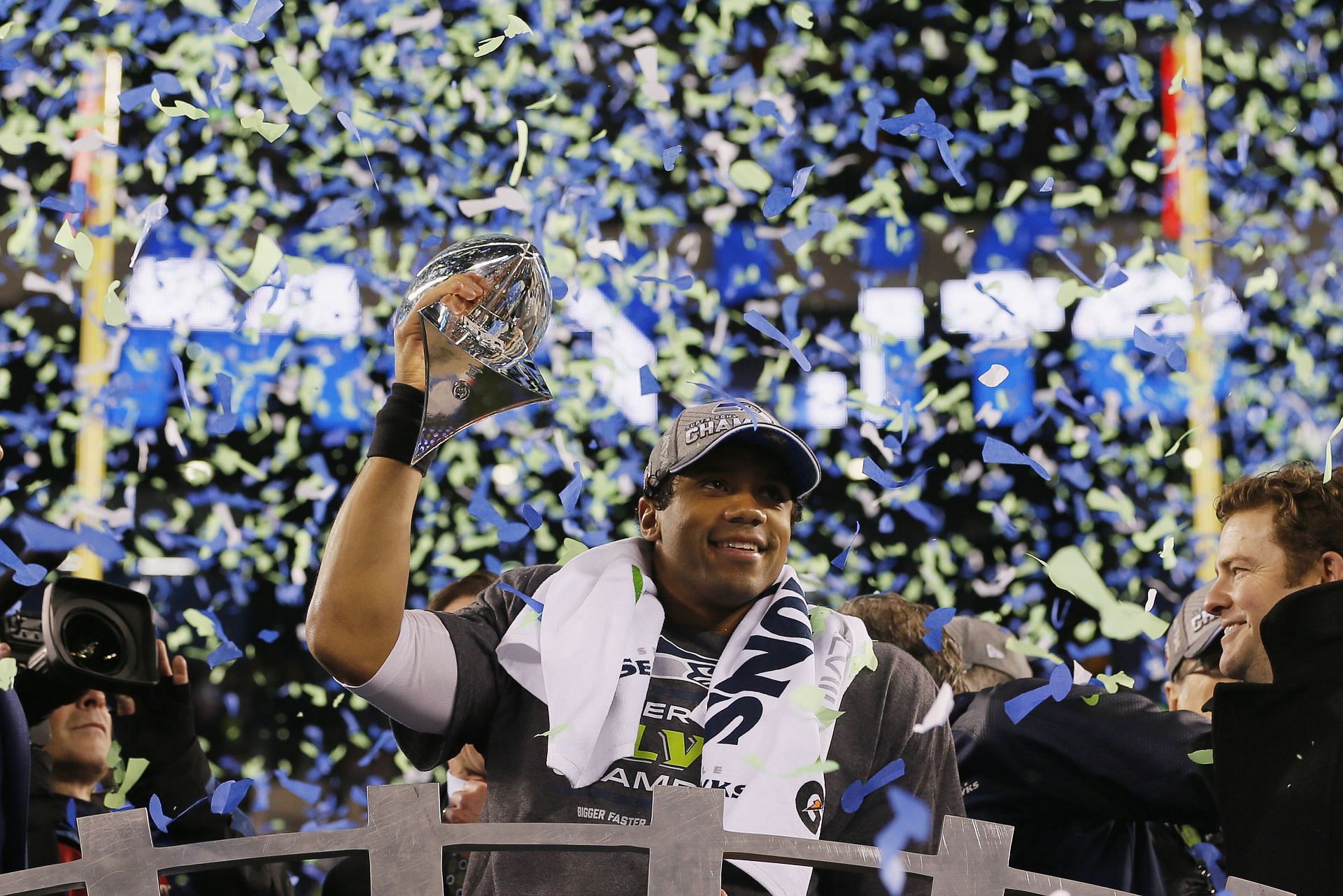 Seattle Seahawks quarterback Russell Wilson lifting the Vince Lombardi trophy