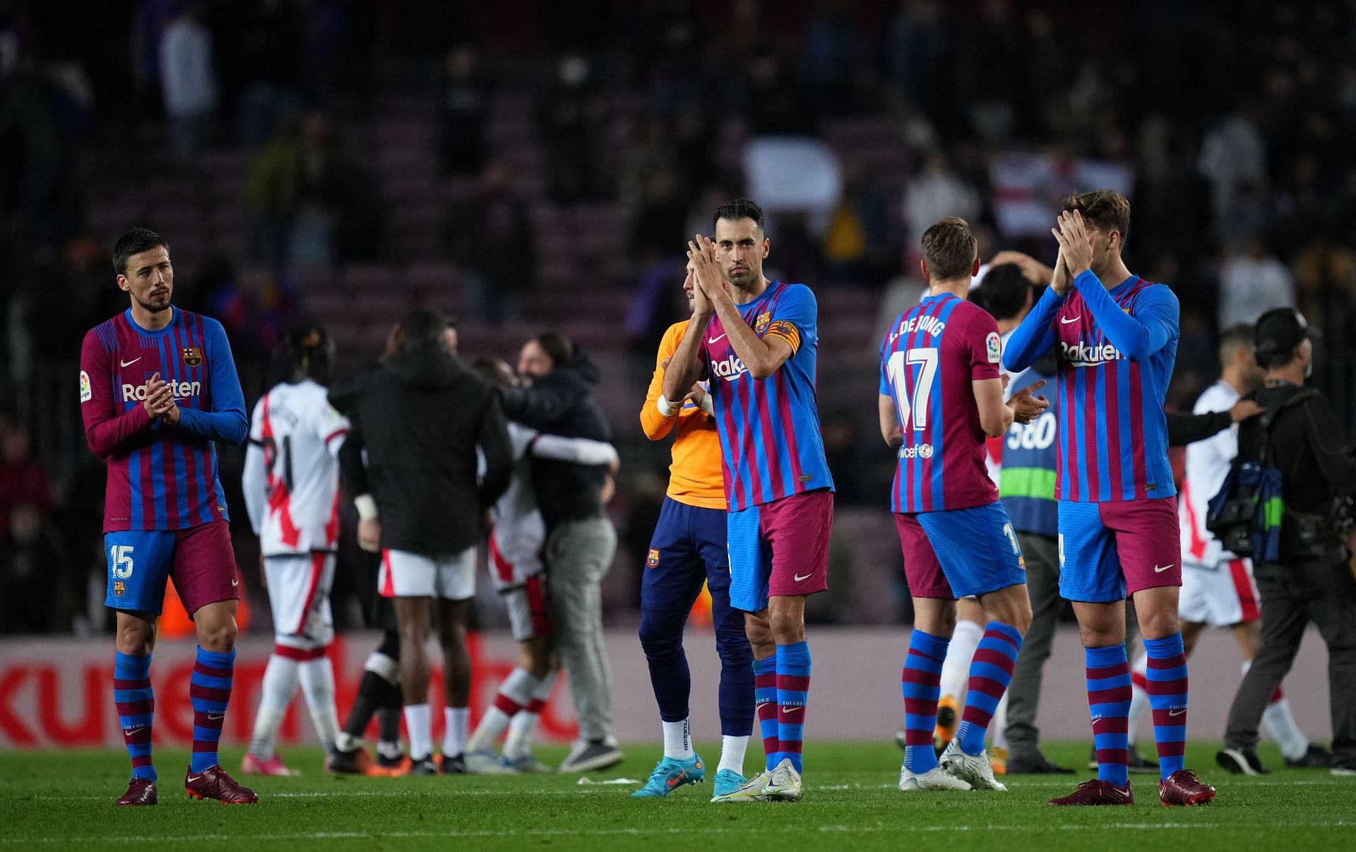 FC Barcelona players applaud the fans.
