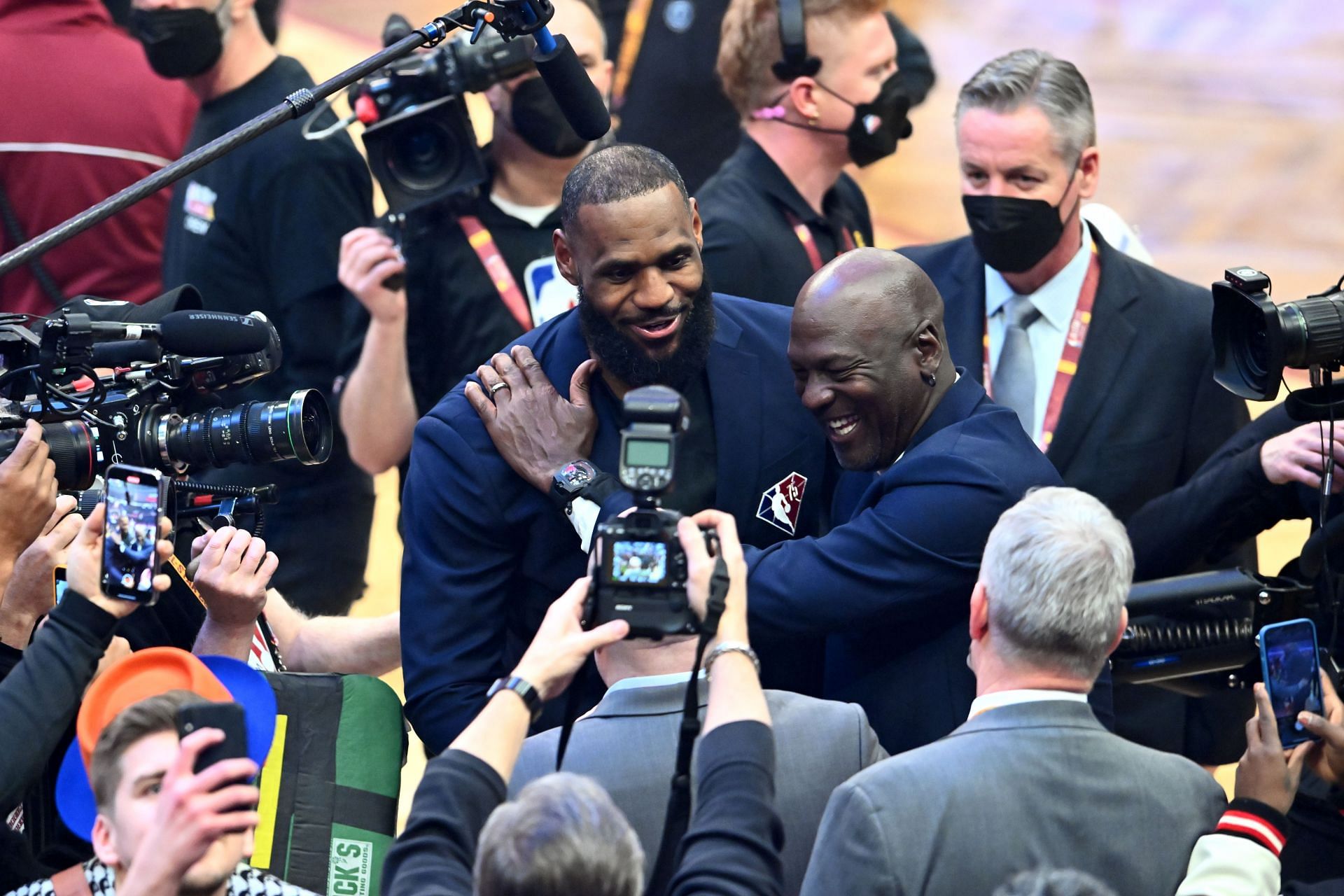 Michael Jordan and LeBron James hug after the presentation of the NBA 75th Anniversary Team.