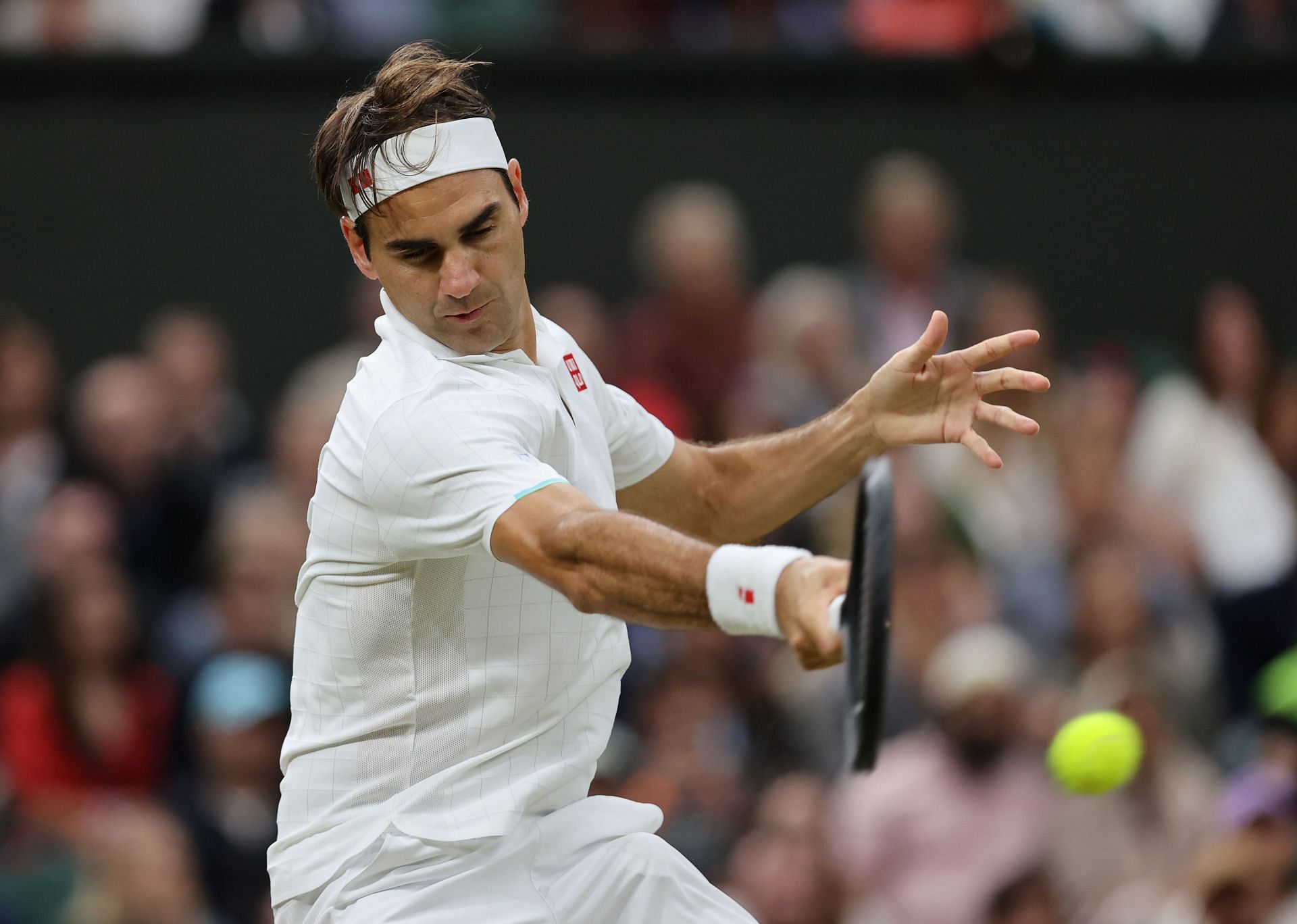 Roger Federer hits a forehand at the 2021 Wimbledon Championships