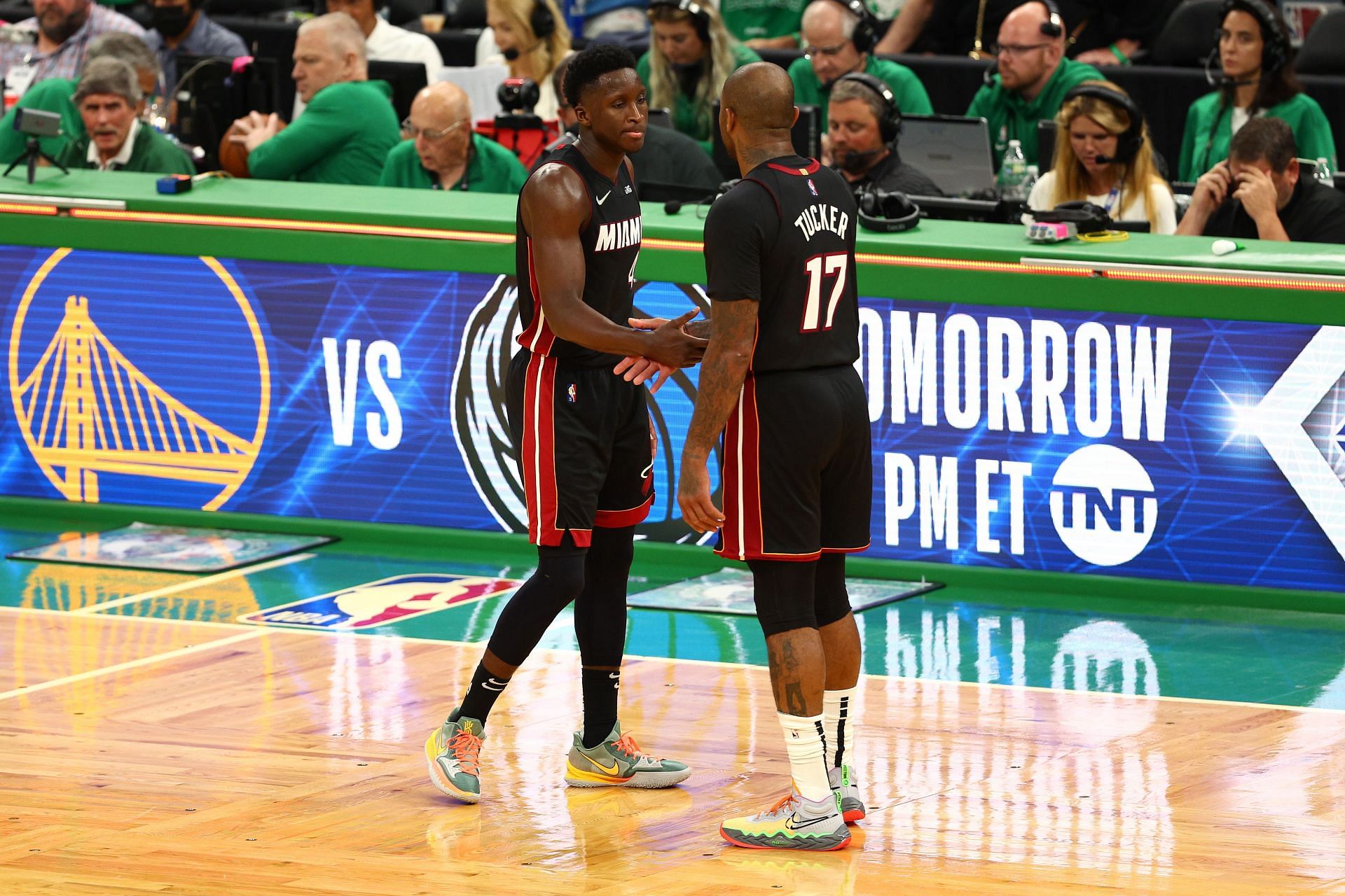 Victor Oladipo and PJ Tucker of the Miami Heat react after beating the Boston Celtics in Game Three.