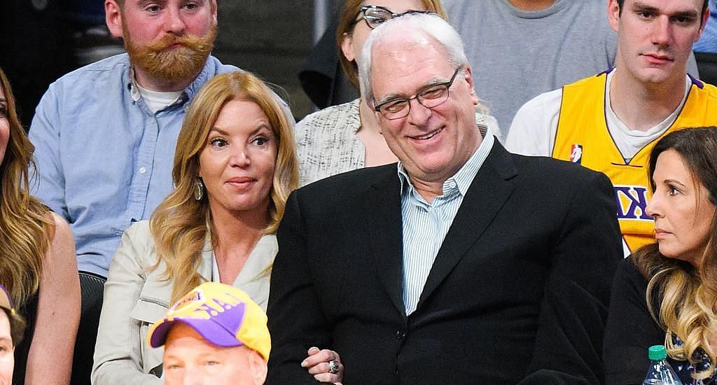 Phil Jackson and Jeanie Buss courtside at an LA Lakers game.