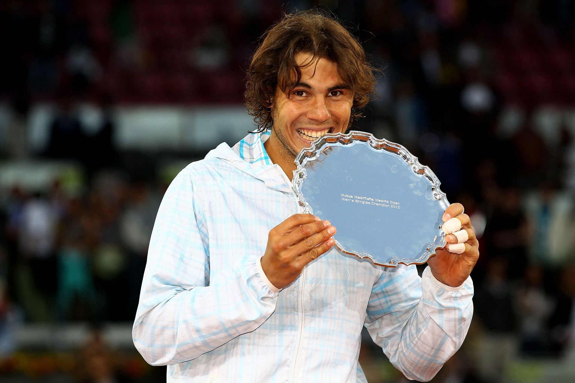 Rafael Nadal with the 2010 Mutua Madrilena Madrid Open winner&#039;s trophy.