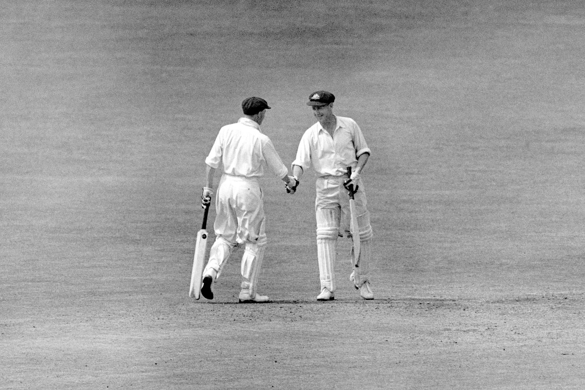 Don Bradman congratulating Arthur Morris on reaching his century during their record 400-runs plus victory chase at Headingley in 1948