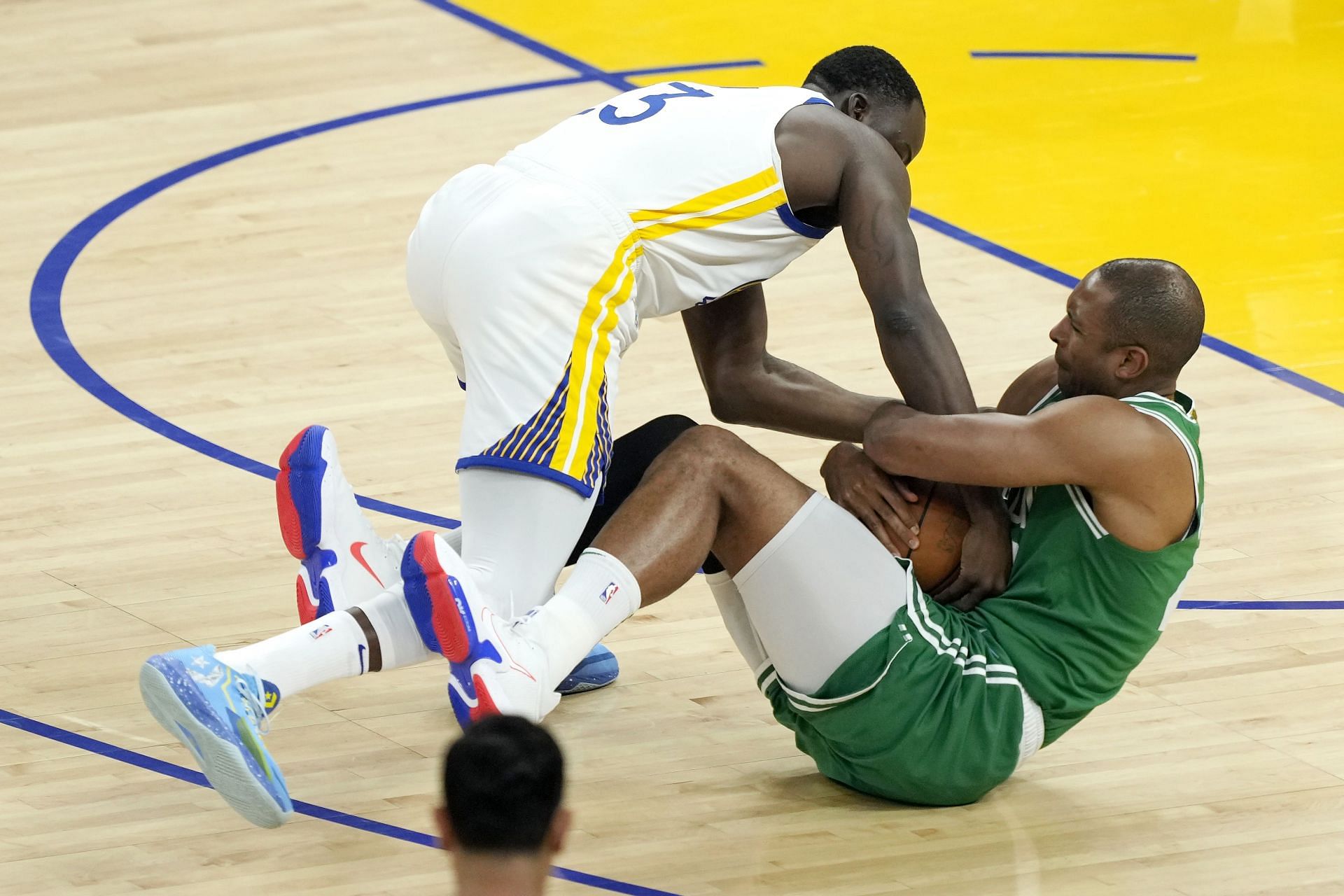 Green wrestles for the ball against Al Horford in the 2022 NBA Finals - Game 2