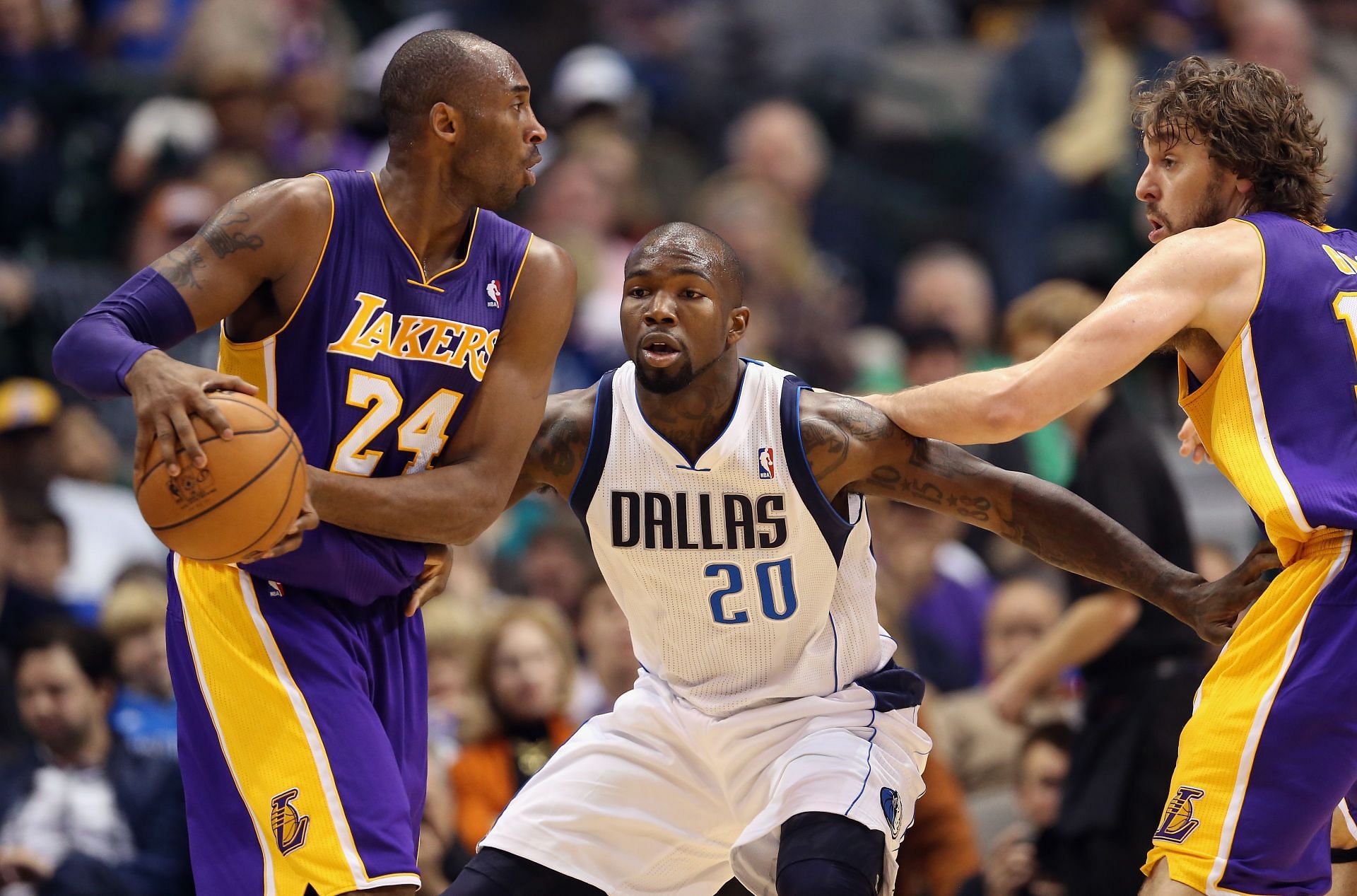 Kobe Bryant of the LA Lakers dribbles the ball against Dominique Jones of the Dallas Mavericks.