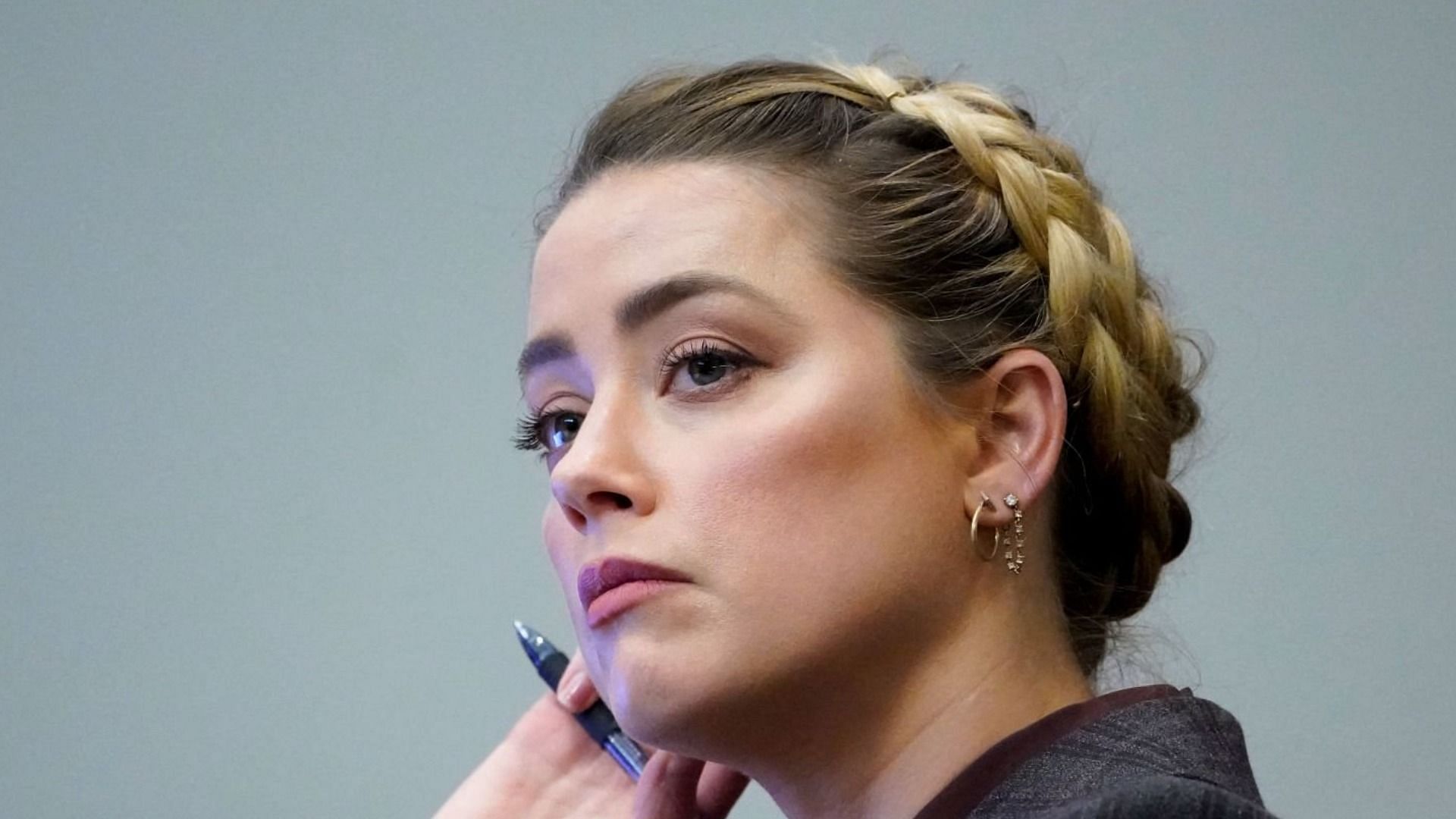 Amber Heard told Savannah Guthrie she stands by her testimony despite losing defamation trial against Johnny Depp (Image via Getty Images)