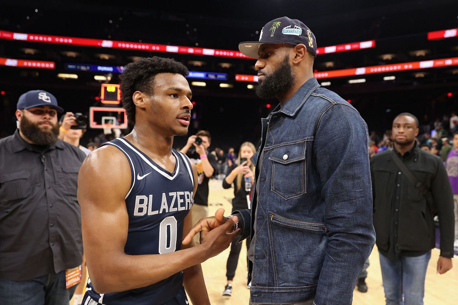 Bronny James (0) of the Sierra Canyon Trailblazers is greeted by his father, LeBron James
