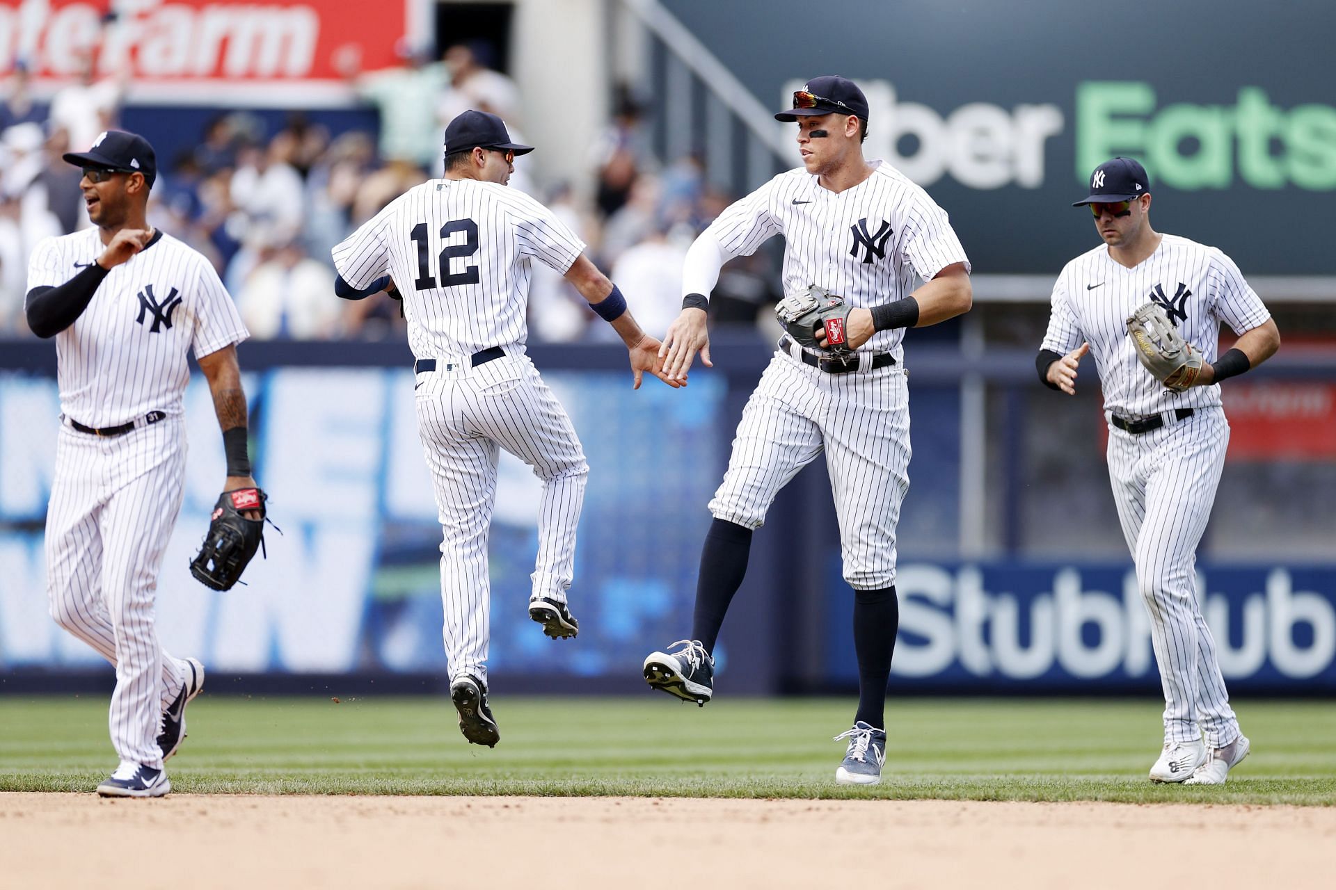 Aaron Judge celebrates with Isiah Kiner-Falefa during a New York Yankees v Detroit Tigers game.