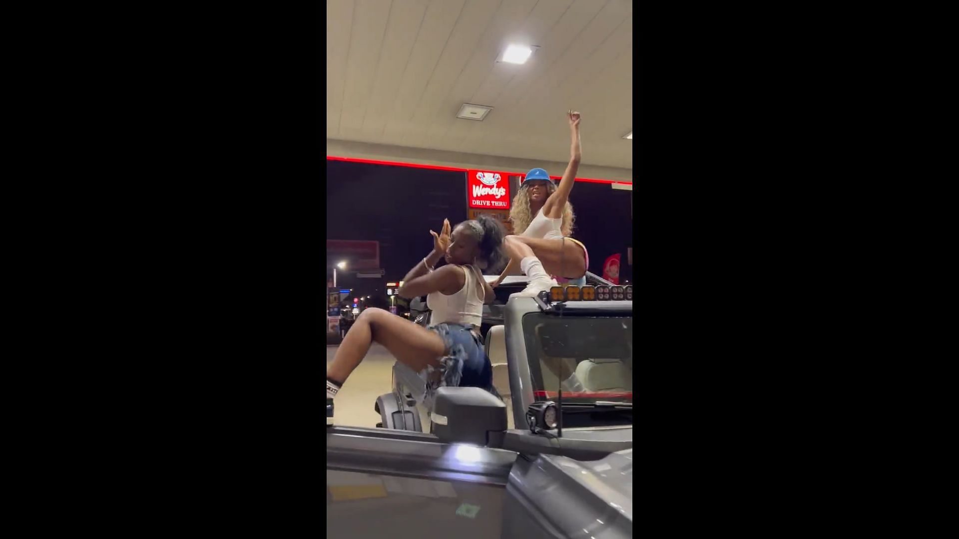 Ciara twerking on a car at a gas station