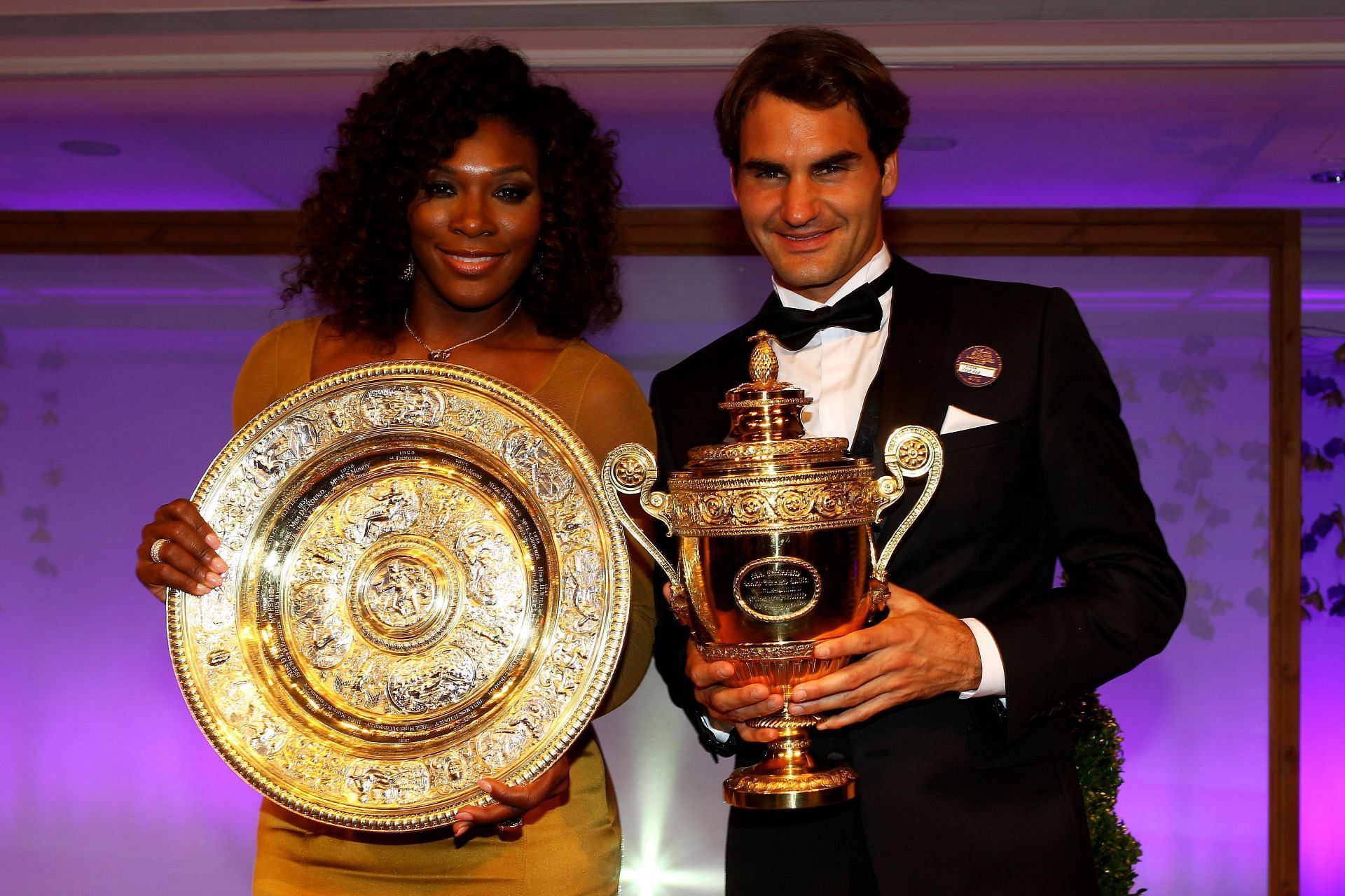 Serena Williams and Roger Federer with their trophies at the 2012 Wimbledon Championships